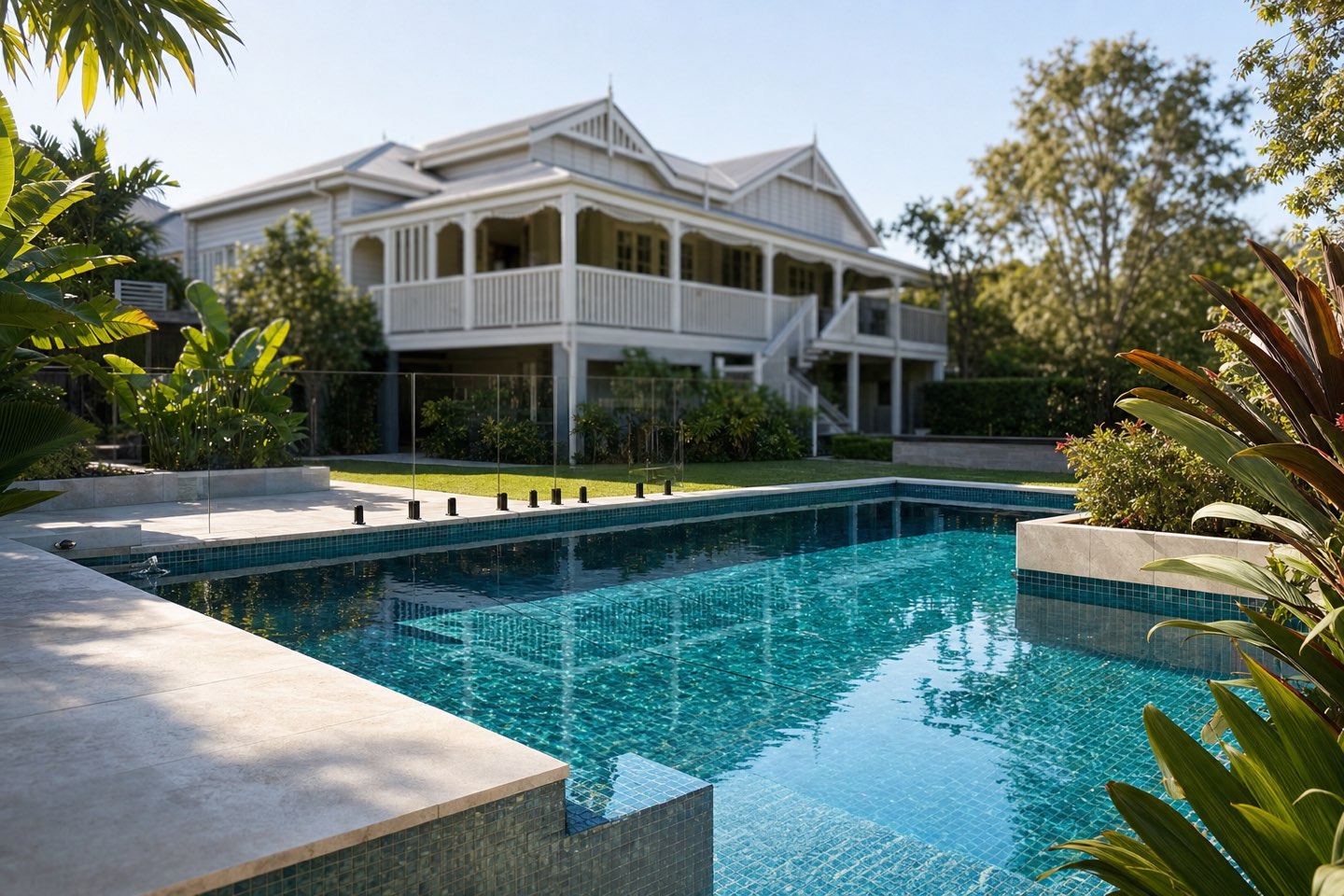 Fully-tiled geometric concrete pool in a Brisbane family backyard
