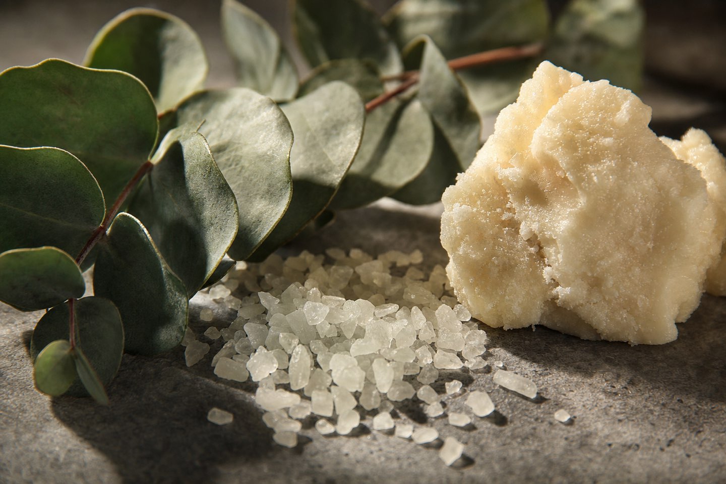 Eucalyptus leaves, mineral salt crystals and shea butter, up close