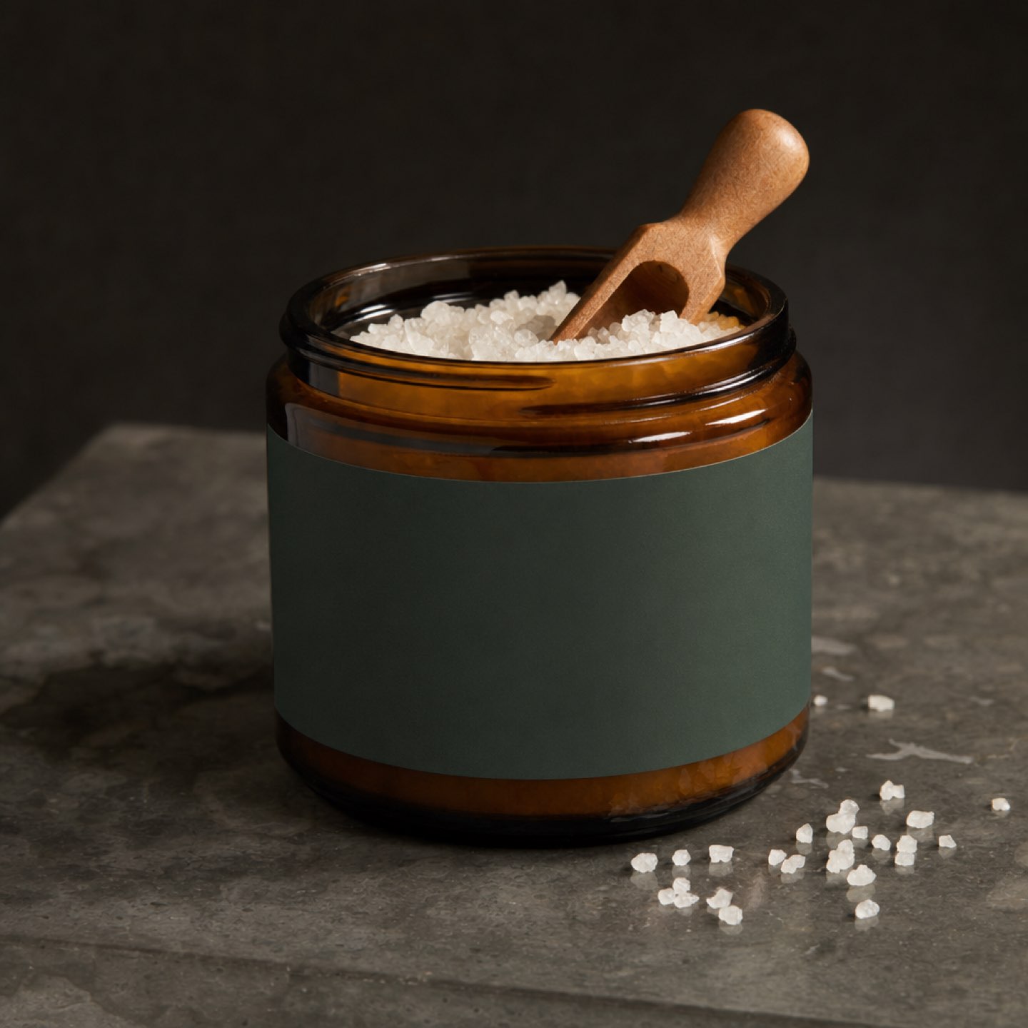 Wind-Down Bath Soak jar with a wooden scoop