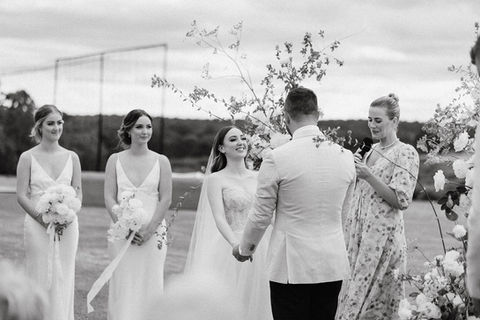 A couple exchanging vows at a styled ceremony